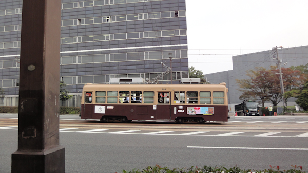 an old looking streetcar on the road